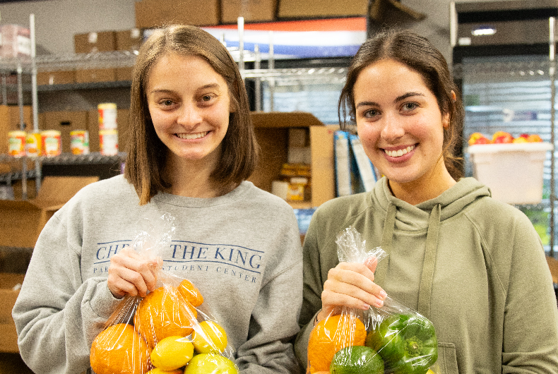 students volunteer in the pantry