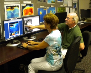 two people at a computer station in the ESL lab