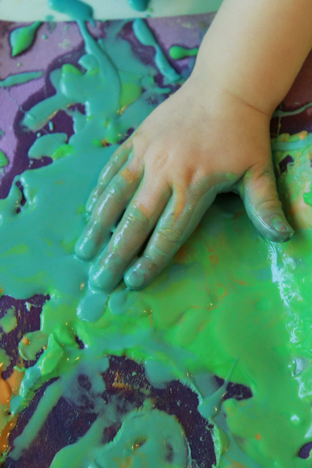 child finger painting