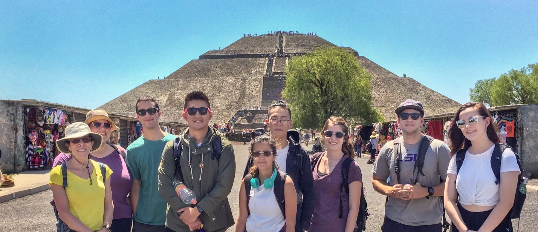 students stand in front of a pyramid in Mexico