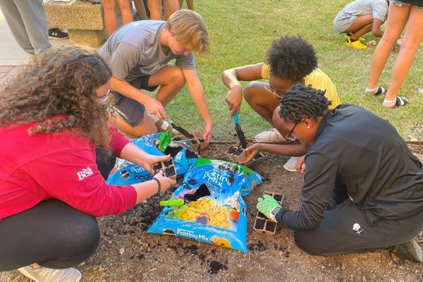 students working on the pollinator garden