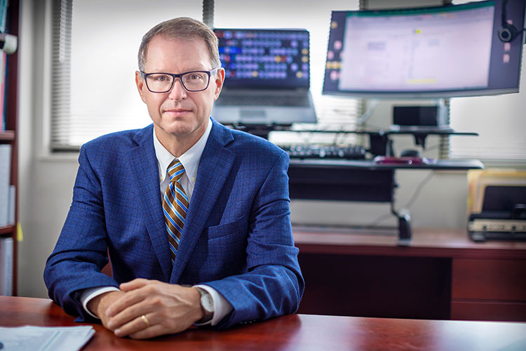 Dr. Wayne Newhauser in his office